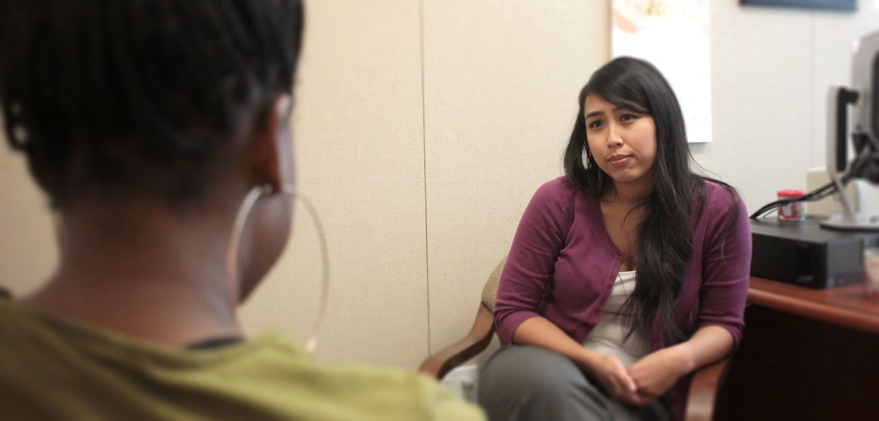 therapist in office talking with student confidentially