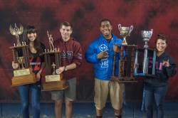 photo of students holding trophies