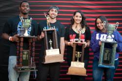 photo of students holding trophies