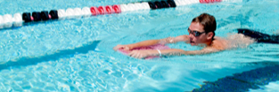 Photo: student swimming in pool lanes in Aquaplex