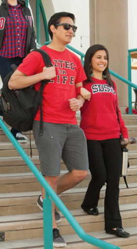 Photo: SDSU pair walking down stairs arm in arm