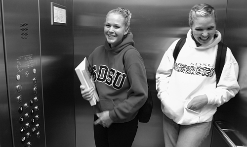 Photo: 2 girls in SDSU elevator