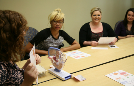 Photo: Women attending a presentation about the pill