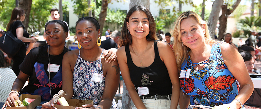 photo of students with their parents at orientation