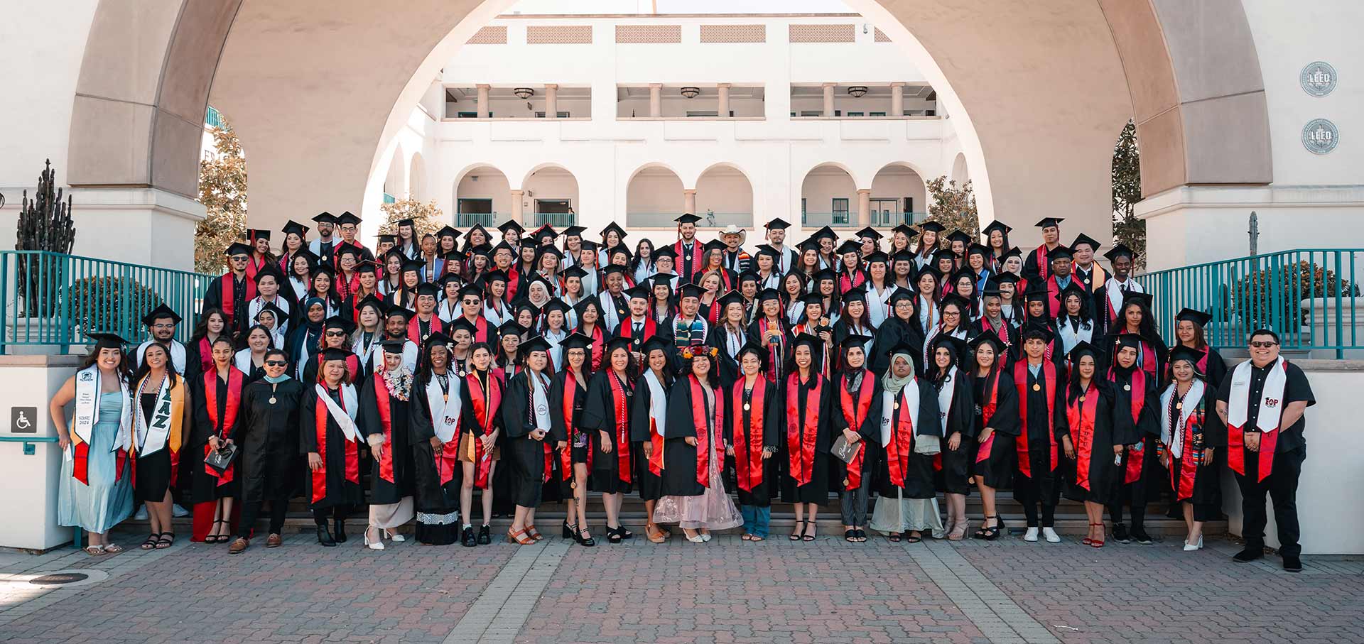 EOP, Outreach and Success class of 2024 take a group picture on the steps in front of the Aztec Student Union at SDSU!