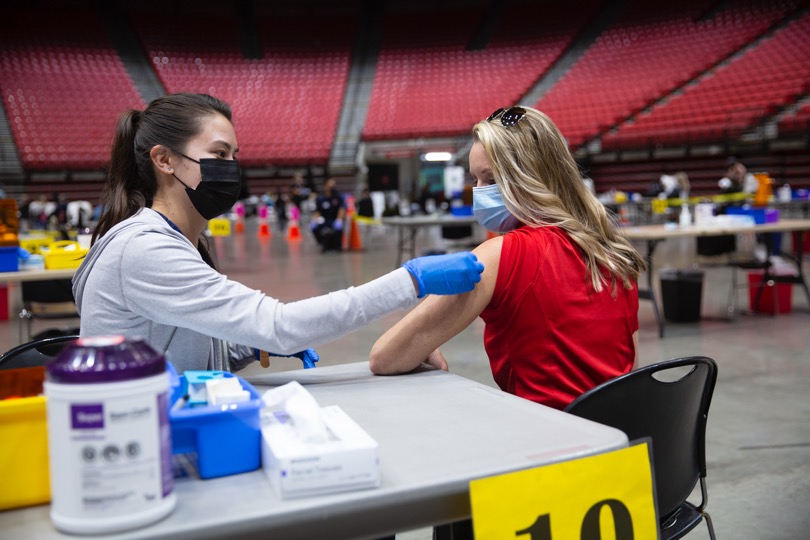 Nurse vaccinating a person