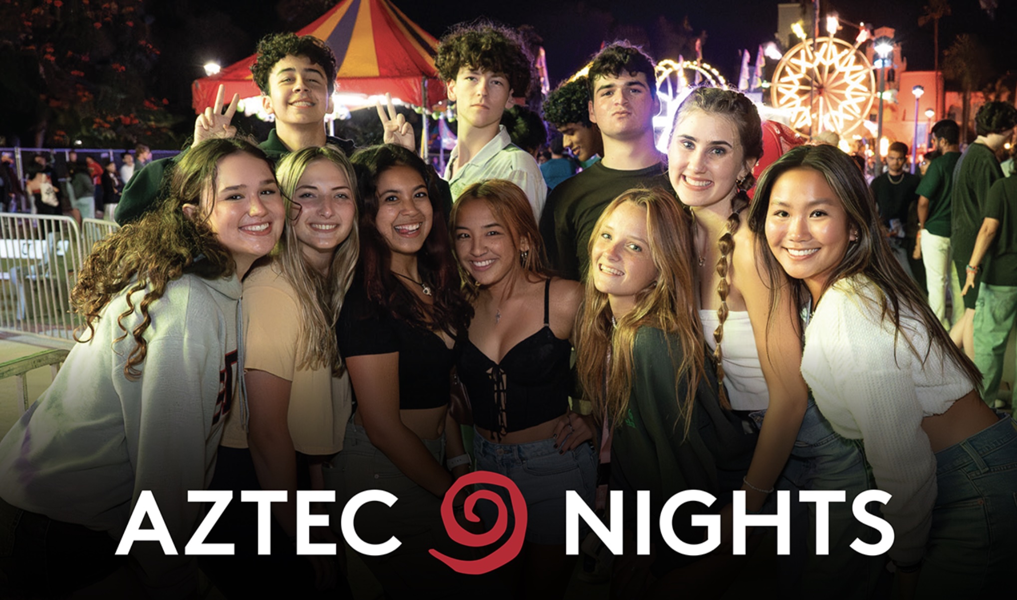 group of students smiling and aztec nights logo