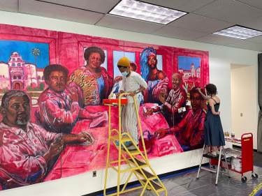artists painting the new mural in the University Library Addition commemorates the contribution of SDSU’s influential Black alumni.
