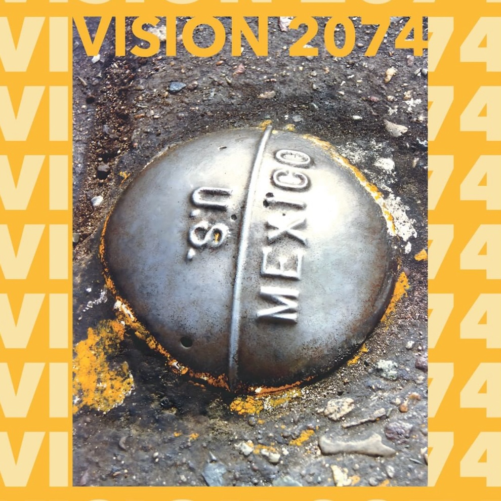 stone on ground that said U.S. and Mexico. background is yellow with repeated text saying "VISION 2074"