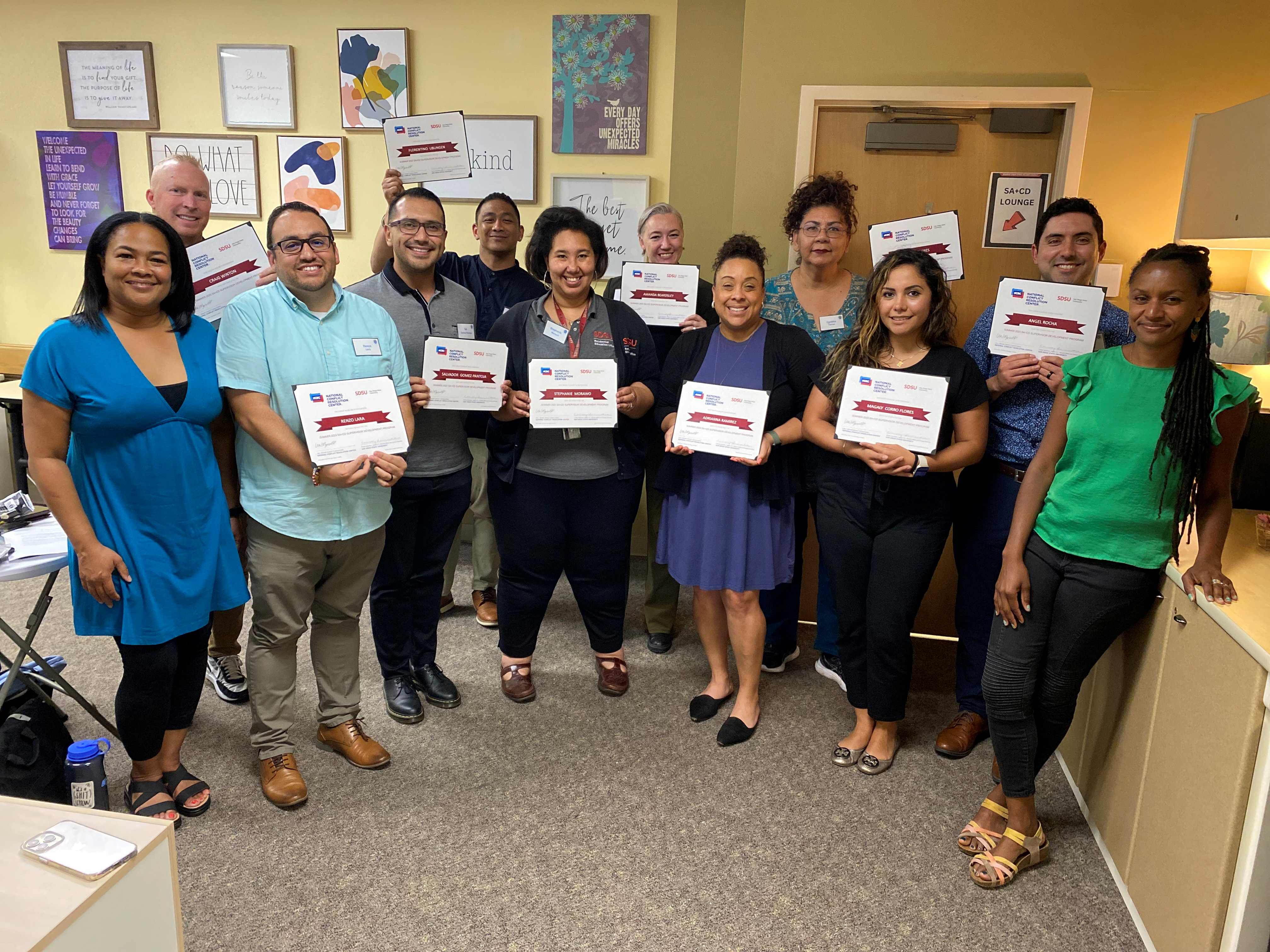 group photo of cohort 3 holding their certificates