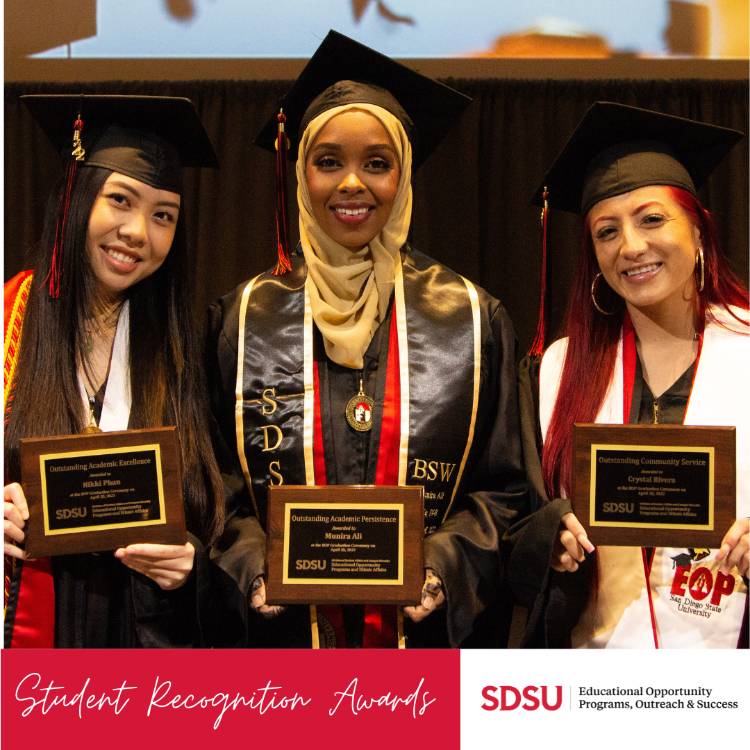 picture of three students holding awards. 