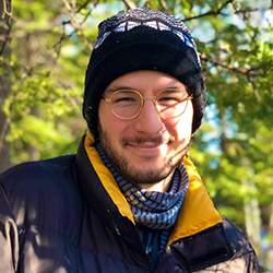 Fabrizio Lacarra Ramirez standing with trees in winter coat